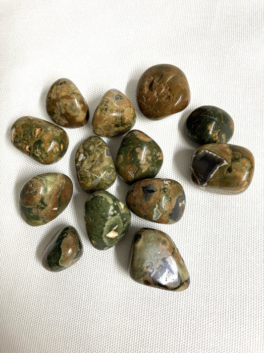 Collection of Rhyolite Crystals on a white fabric background