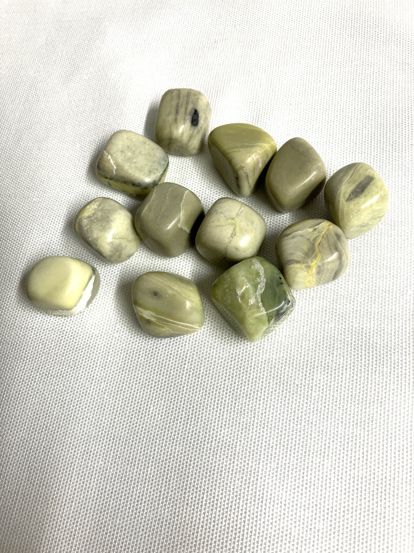 Group of Infinite Crystals on a white fabric background