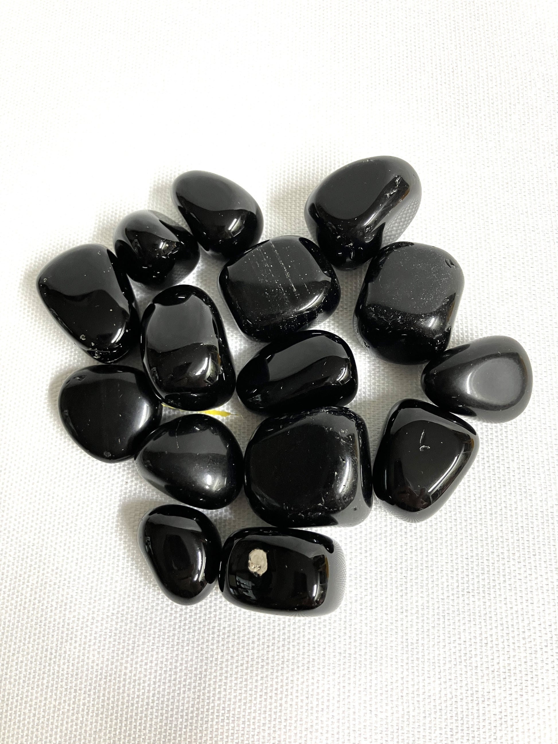 Closeup of Black Obsidian Crystals on a white background