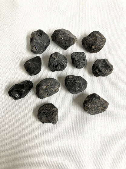 Front view of Rough Apache Tears on a white fabric background