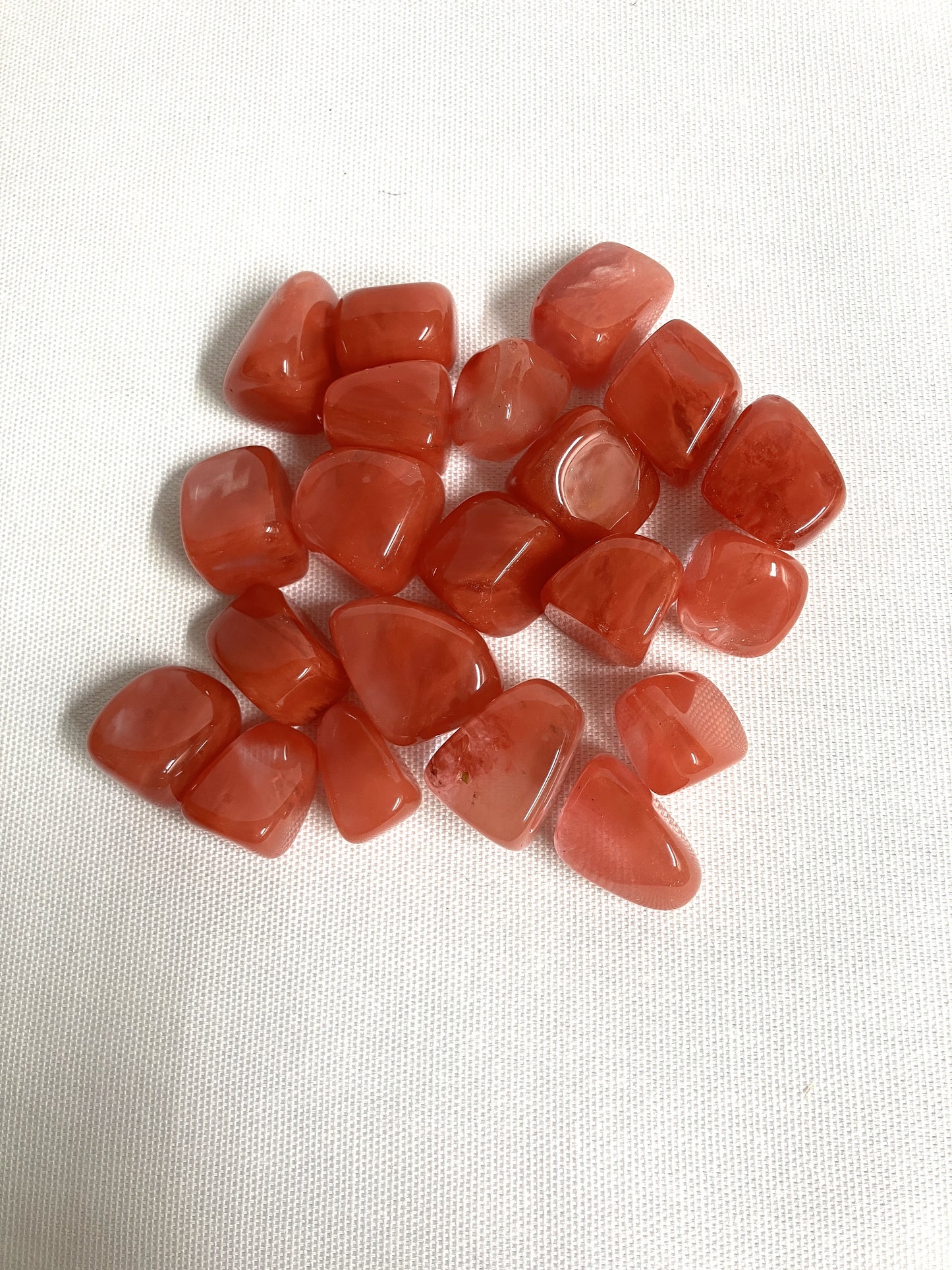 Back view of Cherry Quartz Crystals on a white fabric background