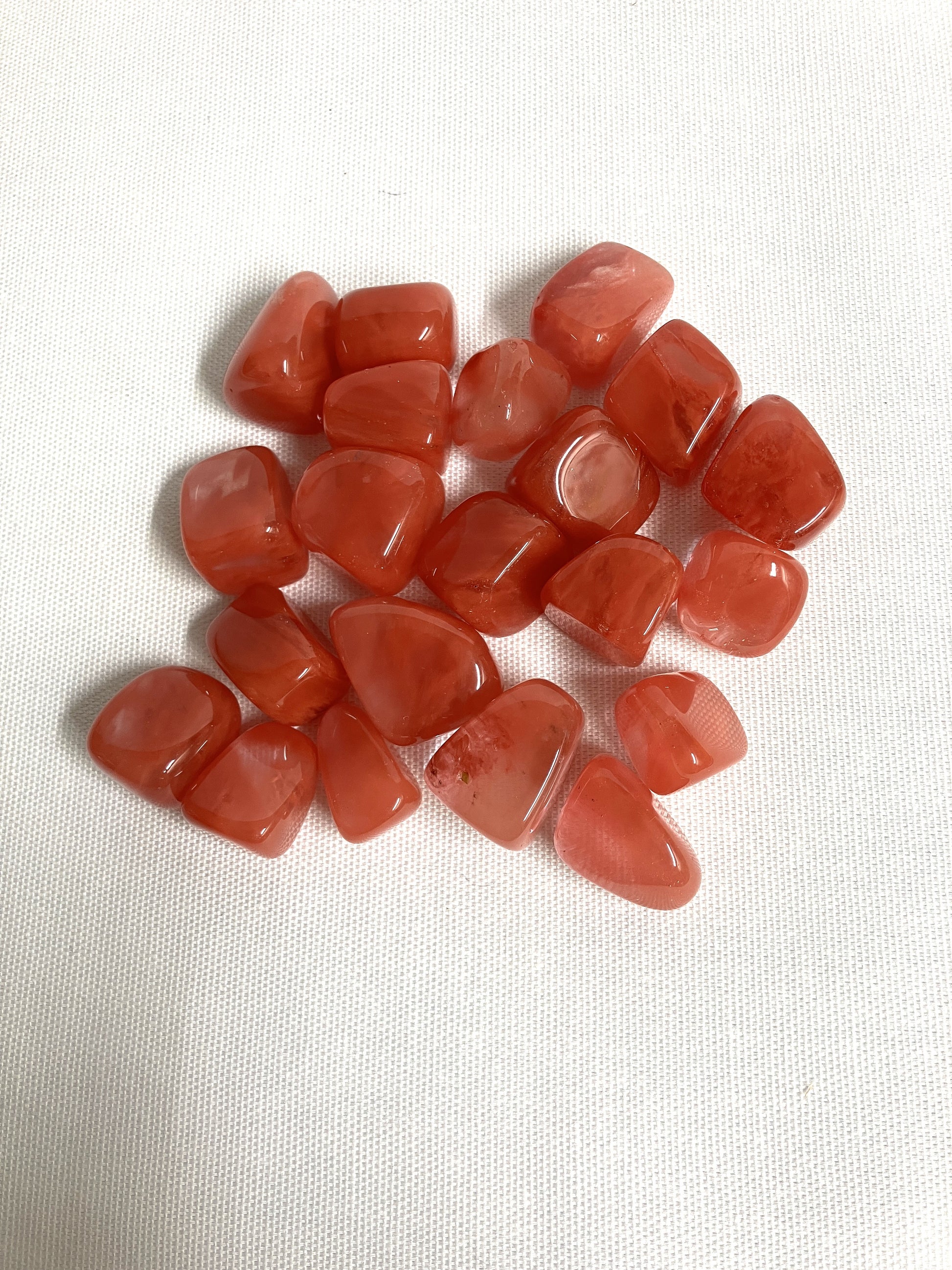 Back view of Cherry Quartz Crystals on a white fabric background