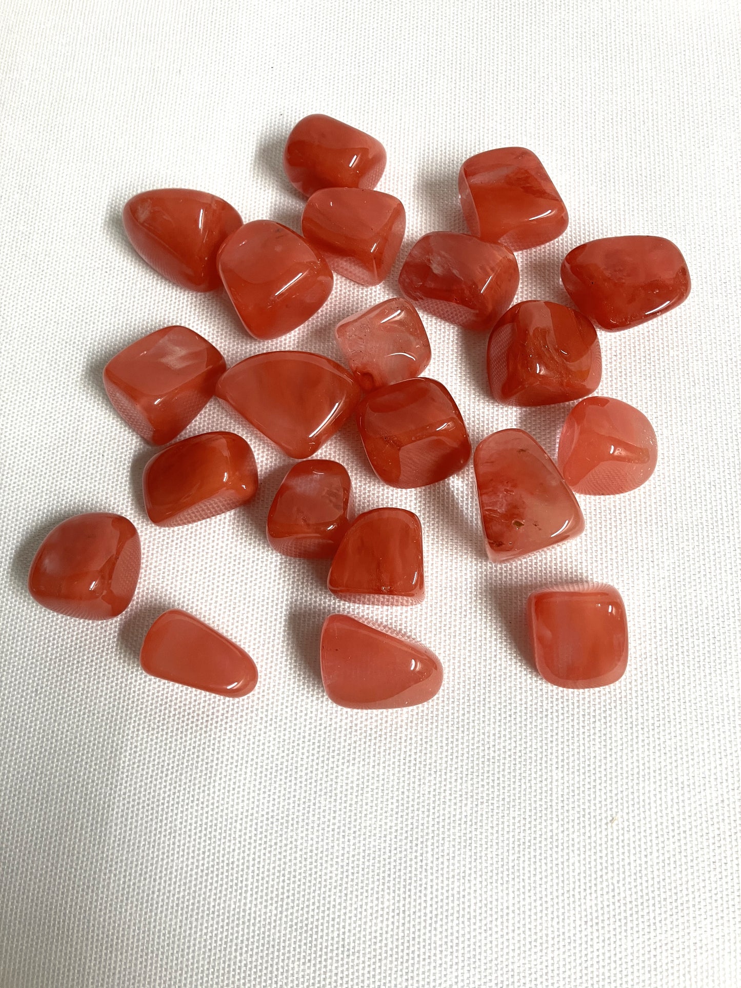 Front view of Cherry Quartz Crystals on a white fabric background