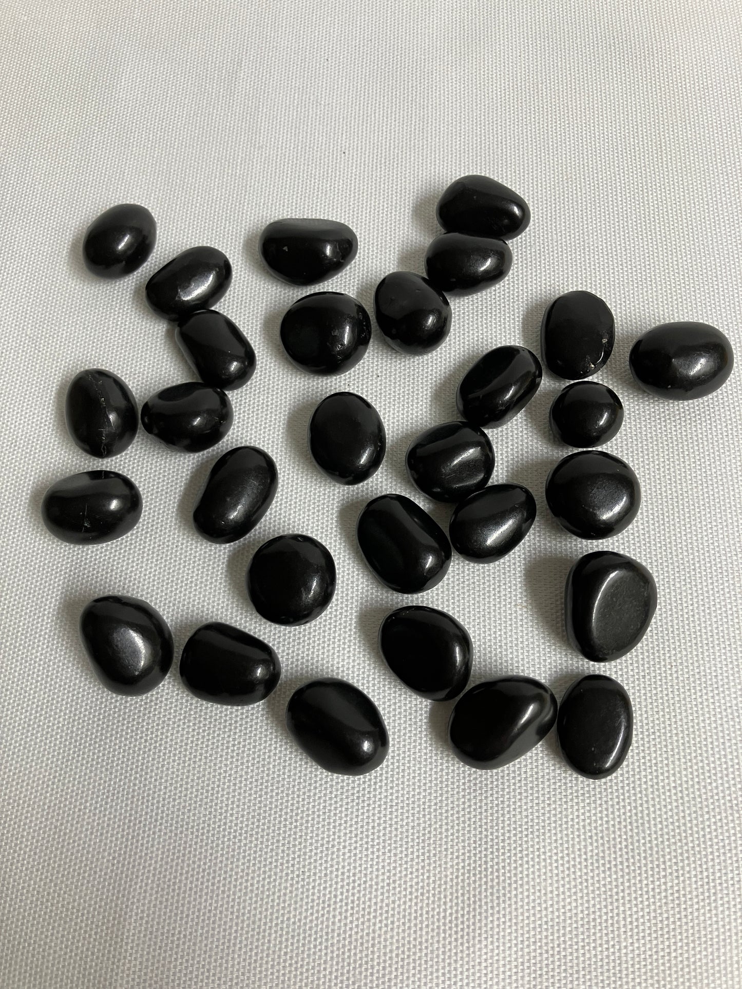 Front view of Shungite Crystals  on a light gray background