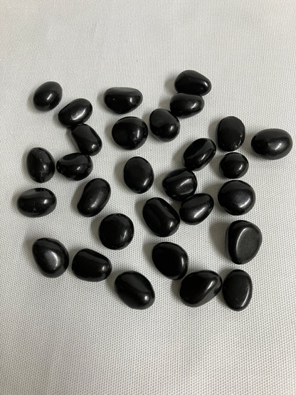 Front view of Shungite Crystals  on a light gray background