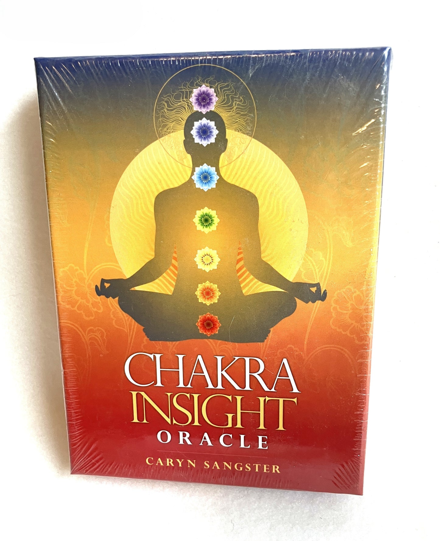 Chakra Insight Oracle card box with a colorful design on a white background