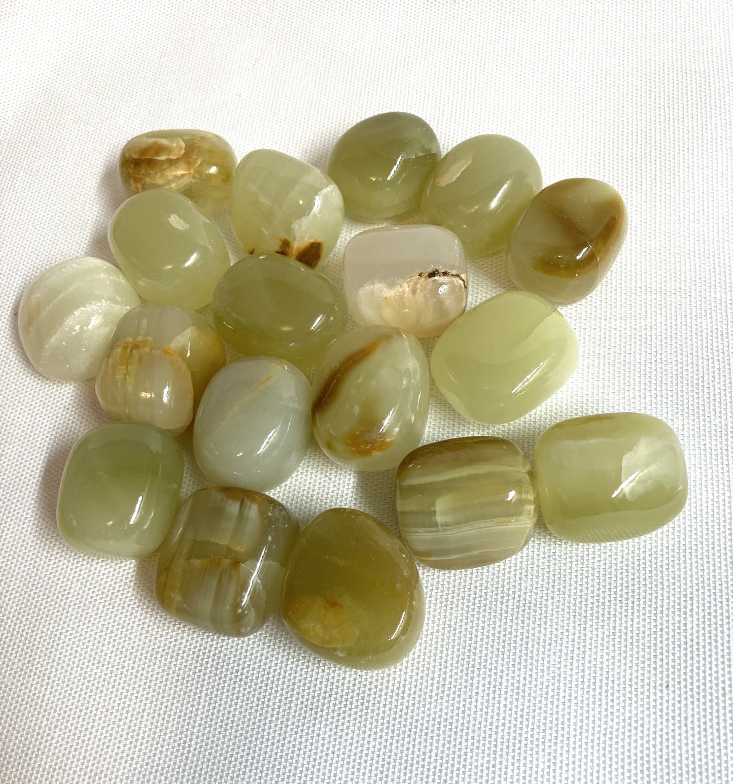 Collection of Green Calcite Crystals on a white background