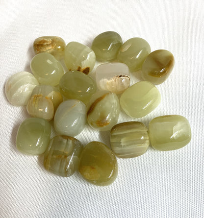 Collection of Green Calcite Crystals on a white background
