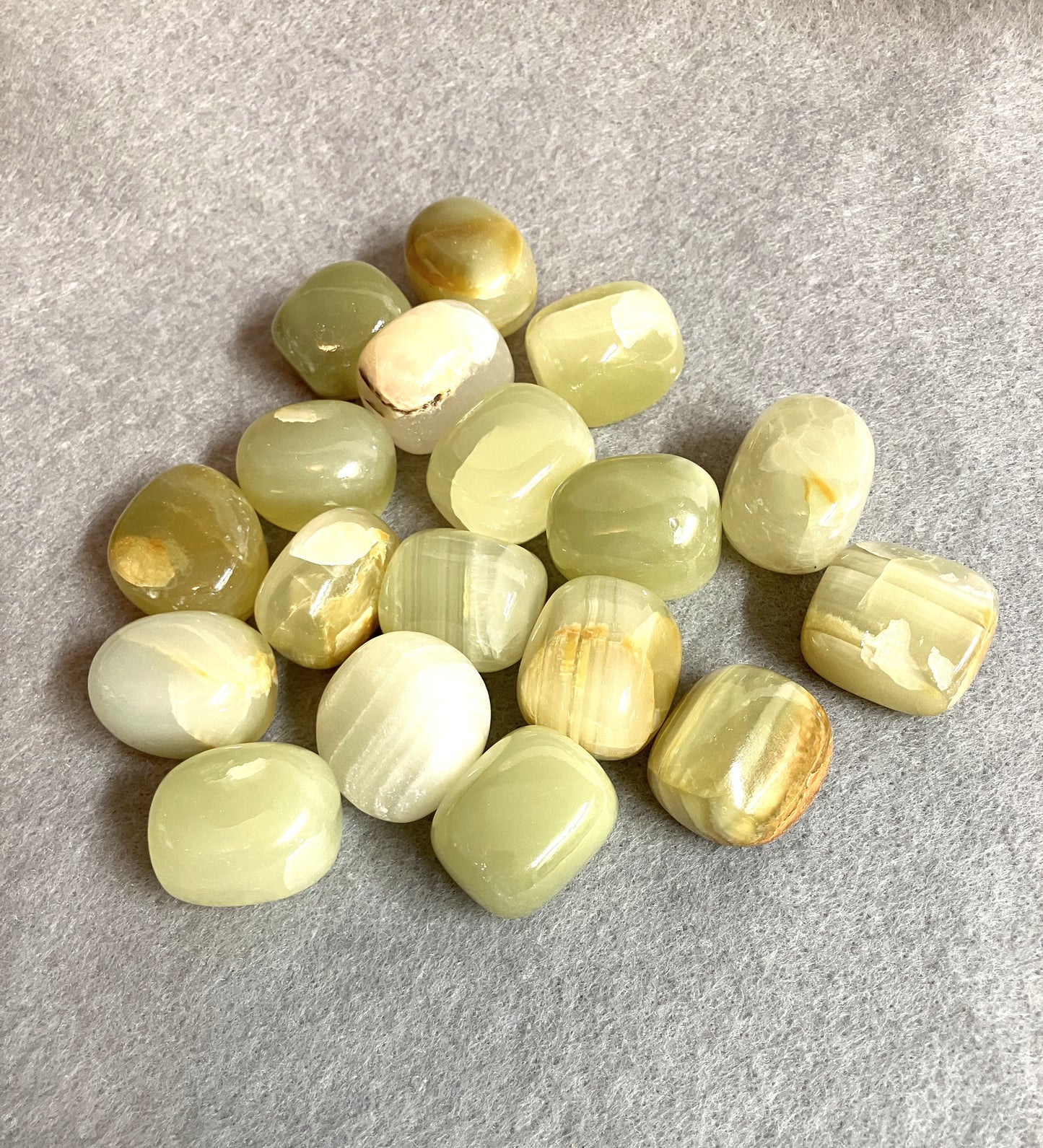 Back closeup of the Green Calcite Crystals on a gray surface
