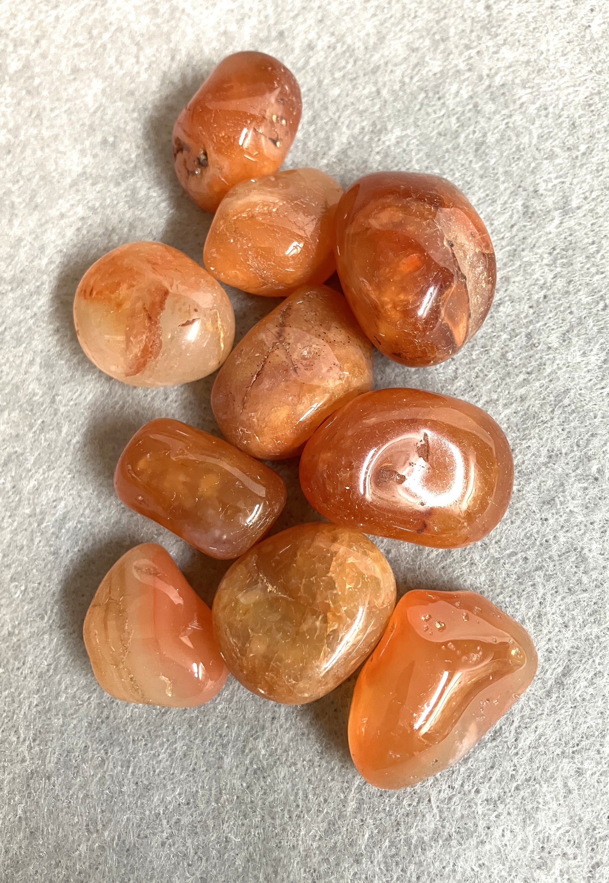 Closeup of Carnelian Crystals front on a gray surface