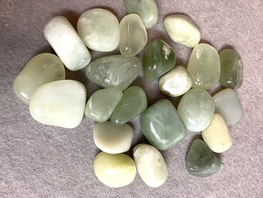 Collection of New Jade Crystals on a gray surface view 1
