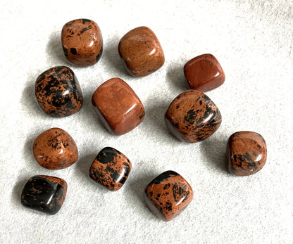 Front view of Mahogany Obsidian Crystals on a white surface