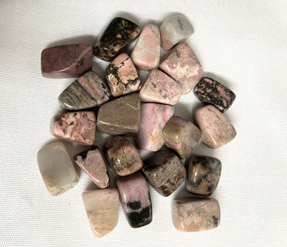 Top view of Rhodonite Crystals on a textured white surface