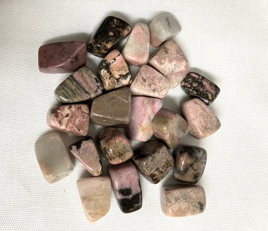 Top view of Rhodonite Crystals on a textured white surface