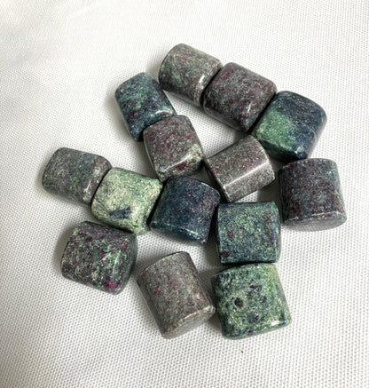 Collection of Ruby Kyanite Crystals on a white fabric background