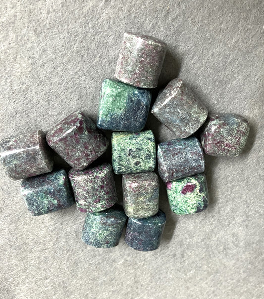 front view of Ruby Kyanite Crystals  on a gray surface