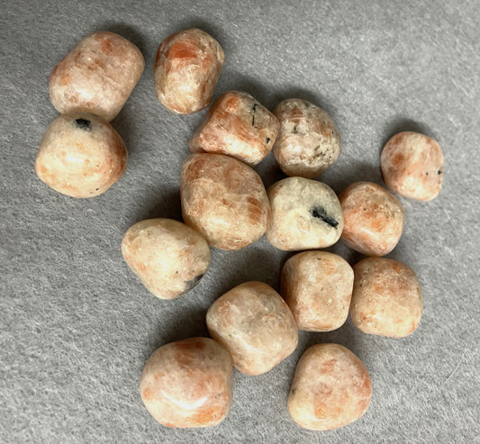 top side view of Sun Stone Crystals on a gray surface