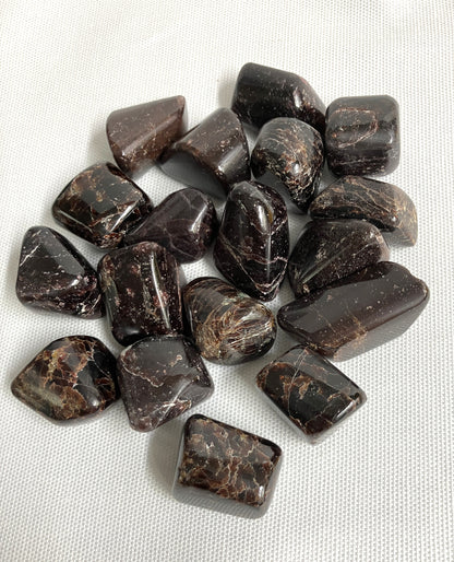 Bottom view of Almandine Garnet Crystals on a white fabric background