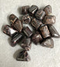 Collection of Almandine Garnet Crystals on a light gray background
