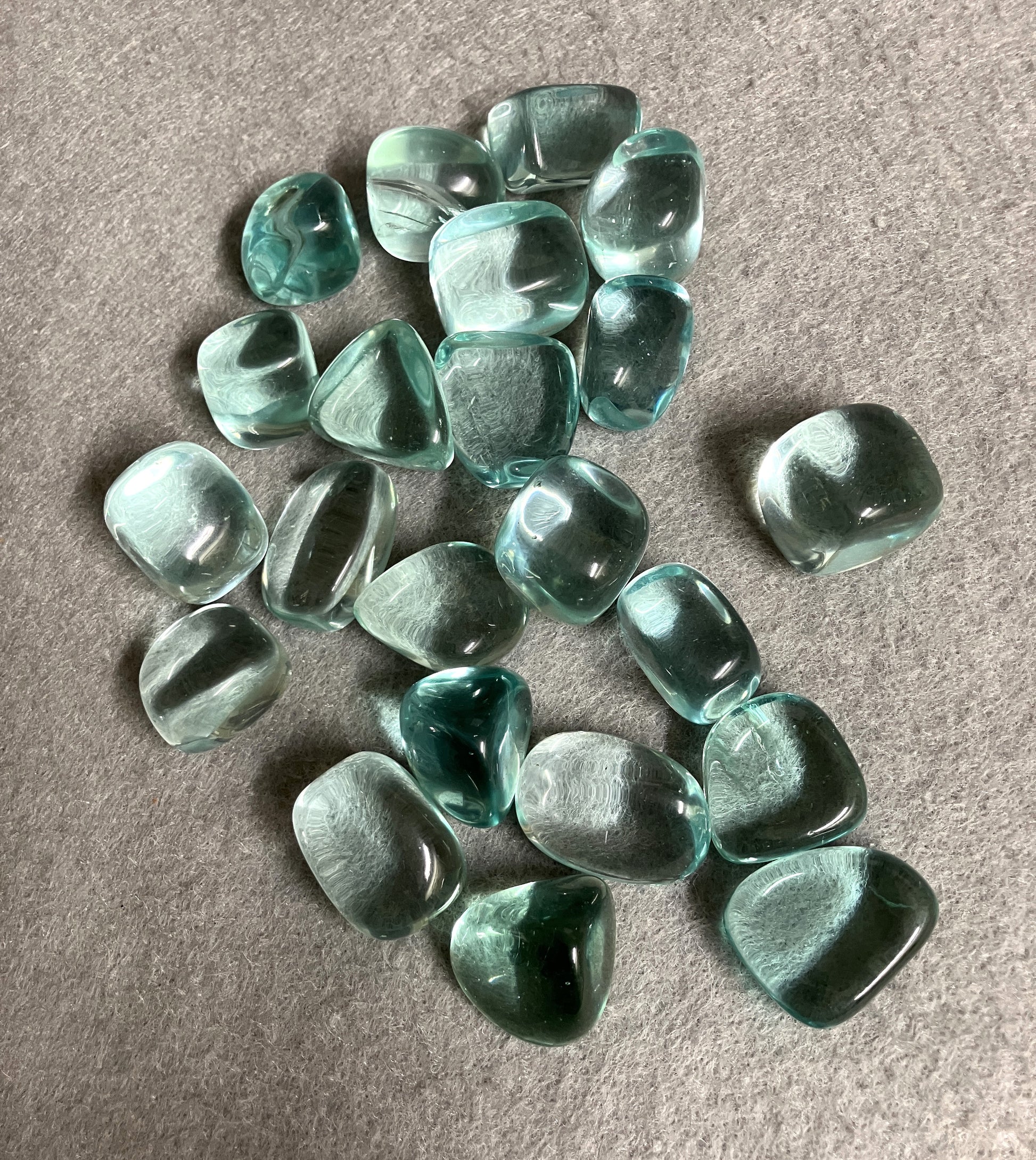 Group of Blue Obsidian Crystal on a gray surface