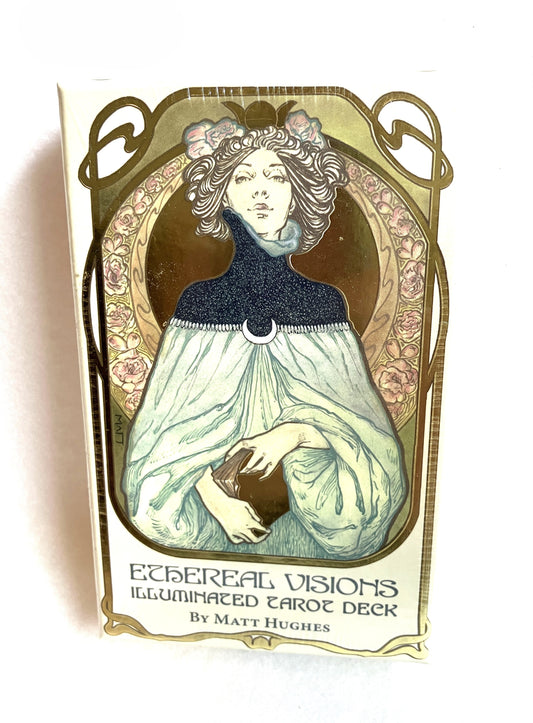 Ethereal Visions Tarot Card deck cover with artistic design of a woman and floral elements on a white background
