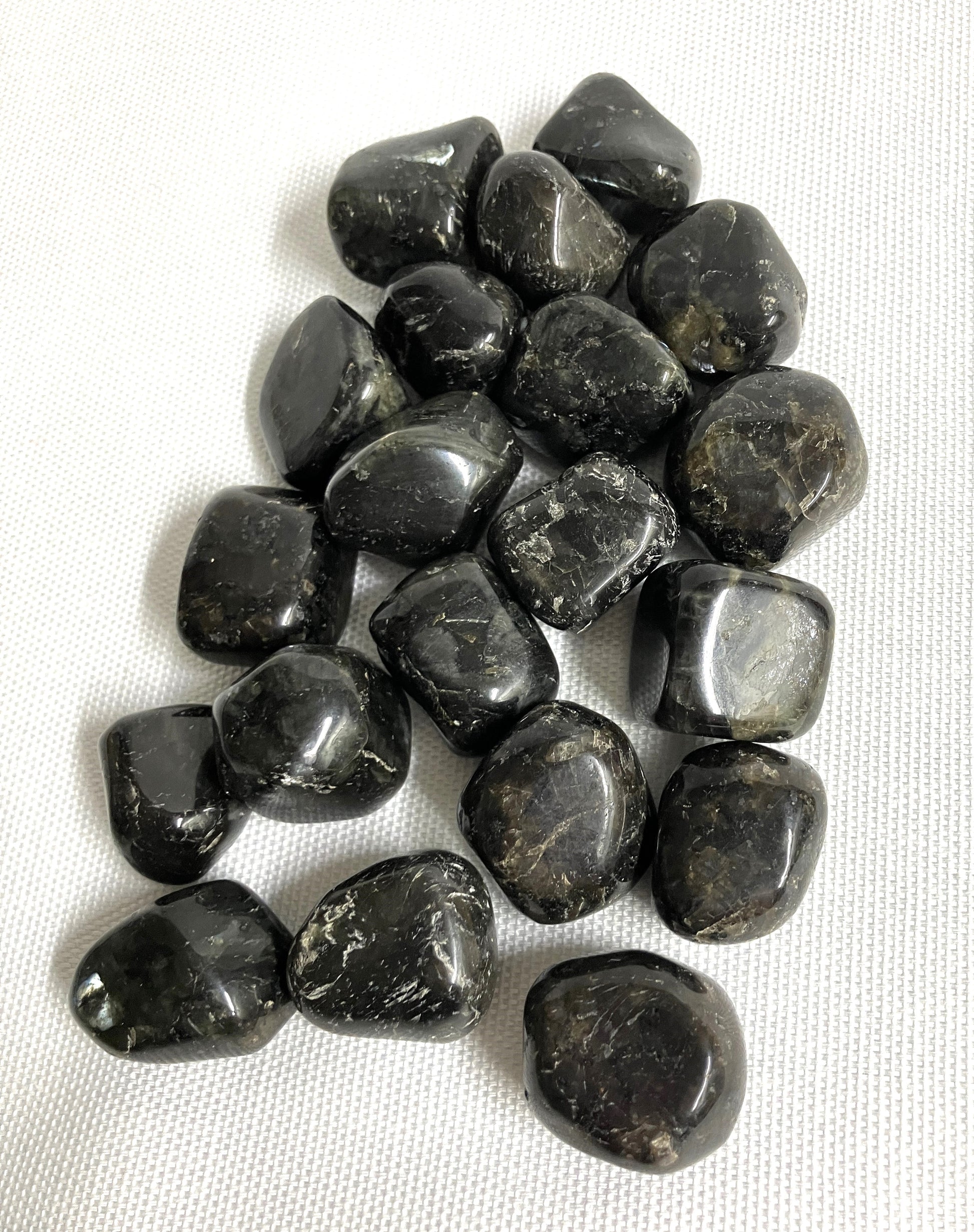 Group of Larvikite Crystals on a white fabric background