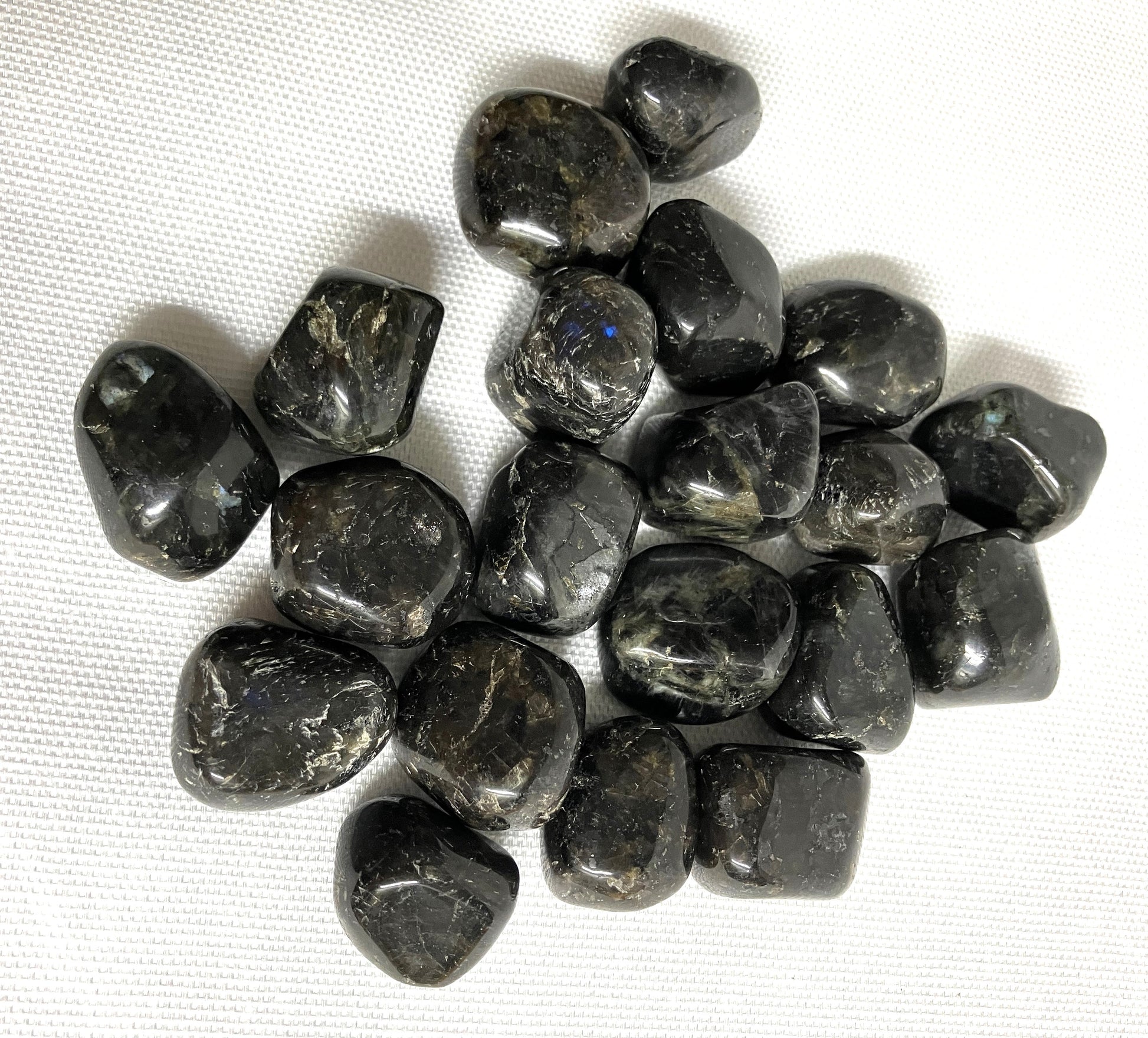 Larvikite Crystals showing the patterns f the crystals on a white background