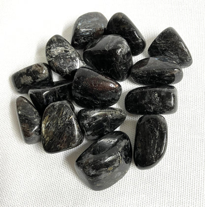 Closeup of Astrophyllite Crystals  on a white fabric background