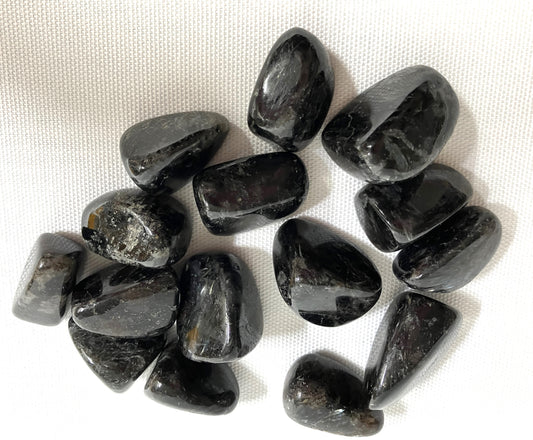 Collection of Astrophyllite Crystals on a white fabric background