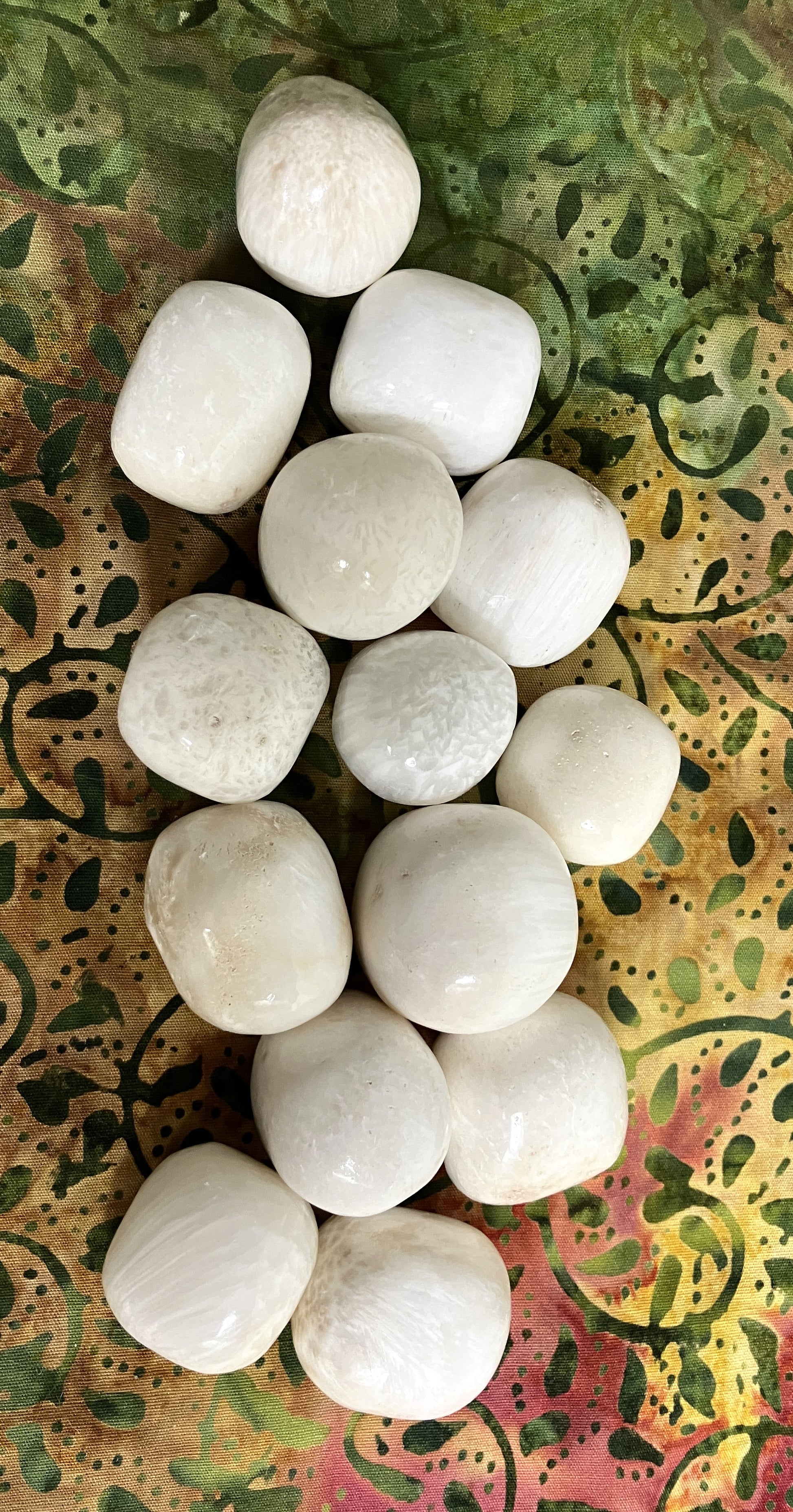 Group of Scolecite Crystals on a patterned fabric background