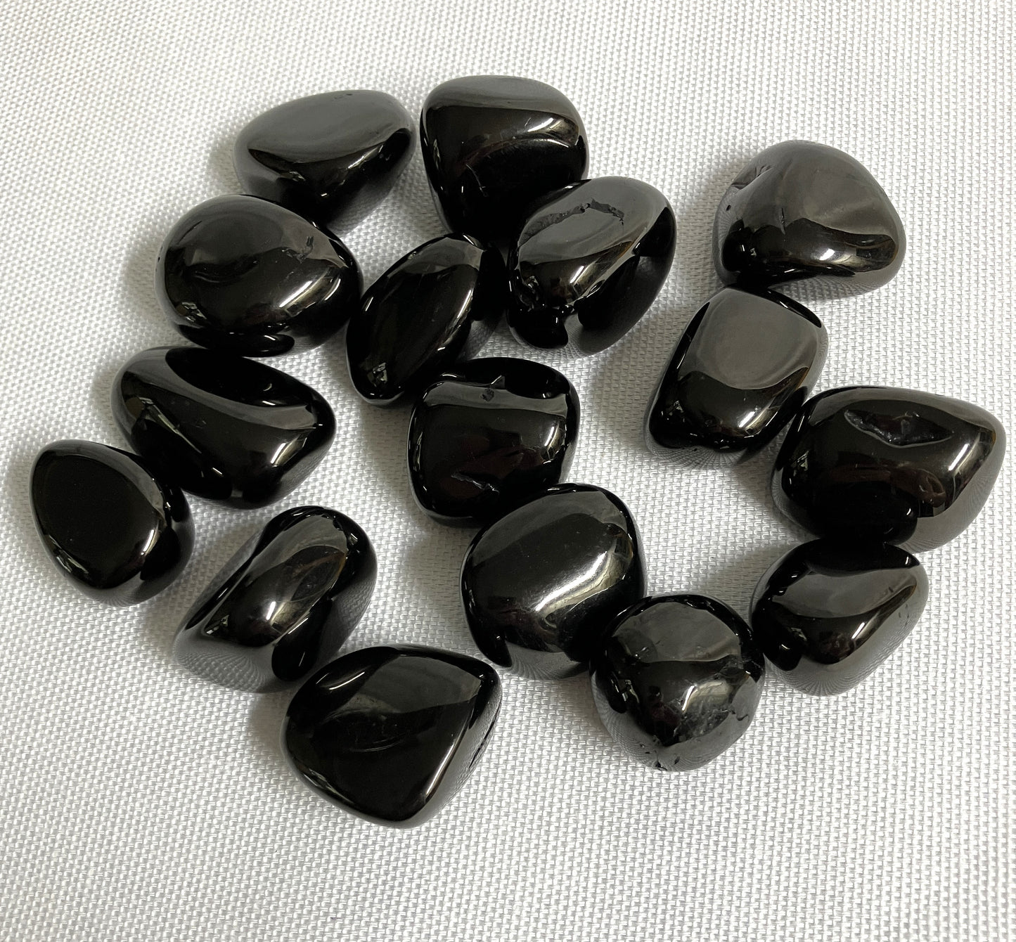 Back view of Jet Crystals on a white fabric background