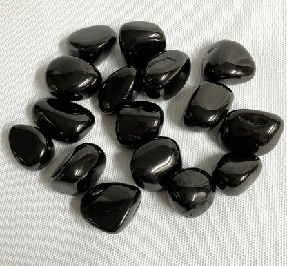 Back view of Jet Crystals on a white fabric background