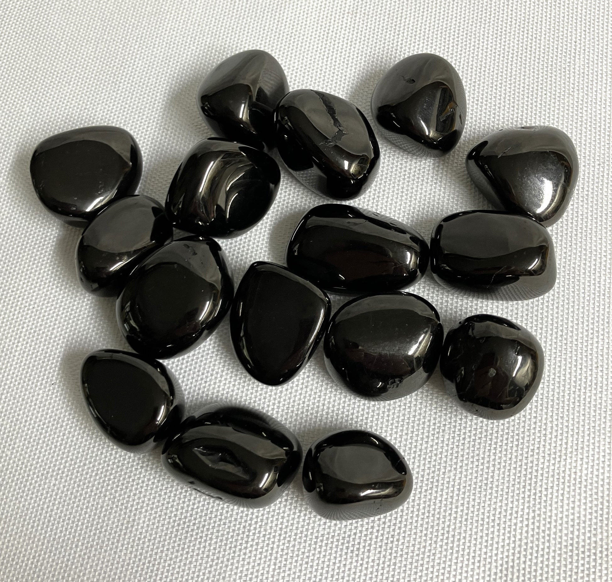 Front view of Jet Crystals on a white fabric background