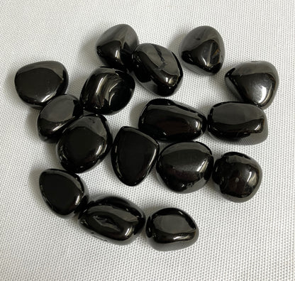 Front view of Jet Crystals on a white fabric background