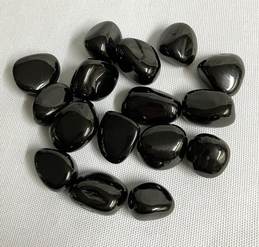 Front view of Jet Crystals on a white fabric background