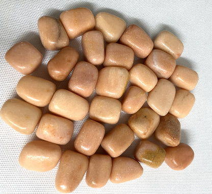 Closeup of Peach Calcite Crystals on a textured white background