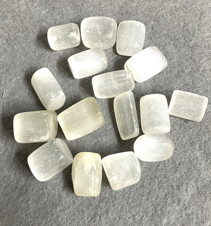 Selenite Crystals shown on a gray fabric to highlight the pattern