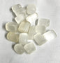 Assorted Selenite Crystals on a textured white background