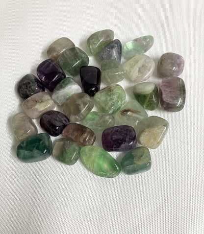 Tumbled Fluorite Crystals on a white fabric background