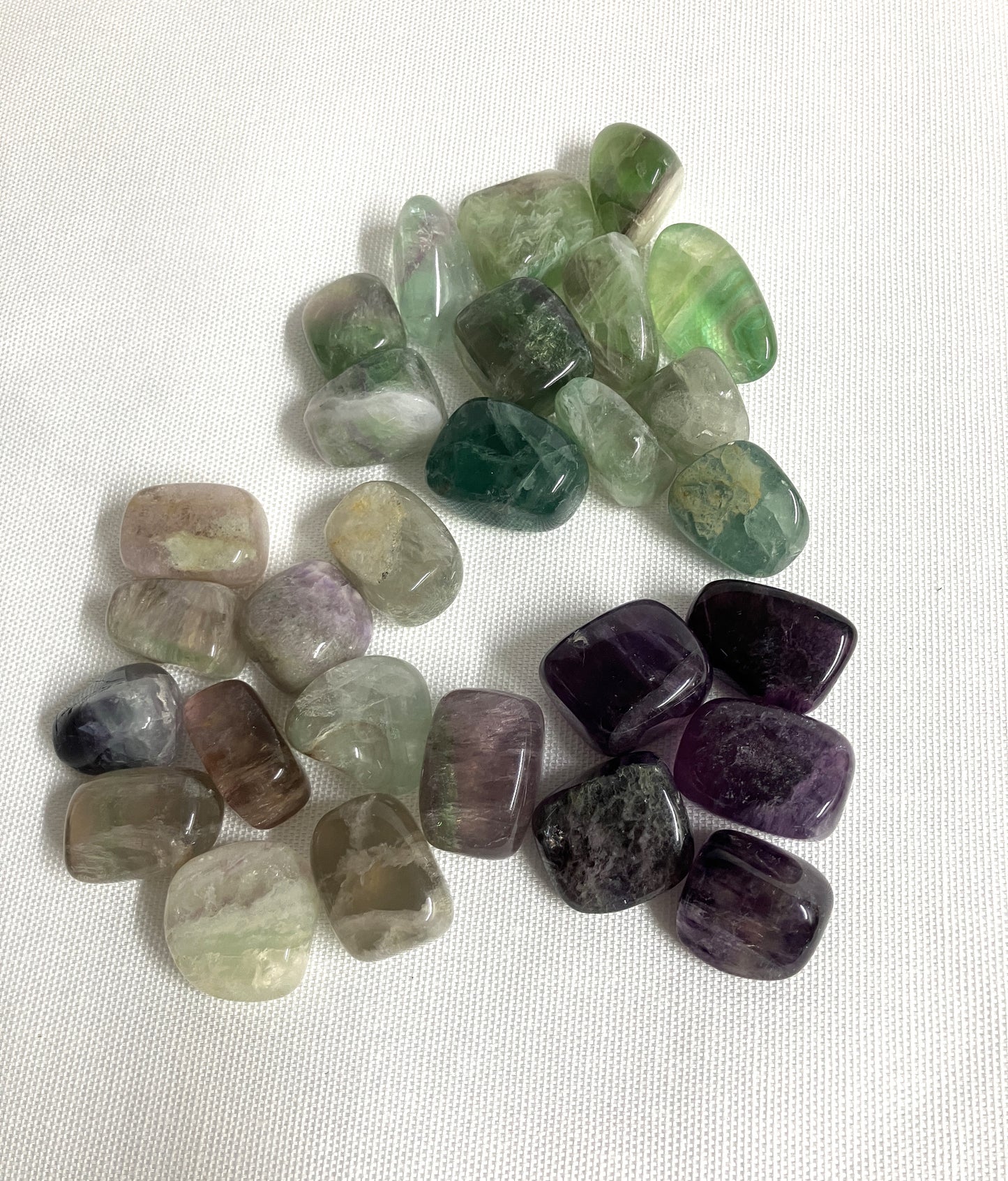 Collection of Fluorite Crystals showing back side on a white background