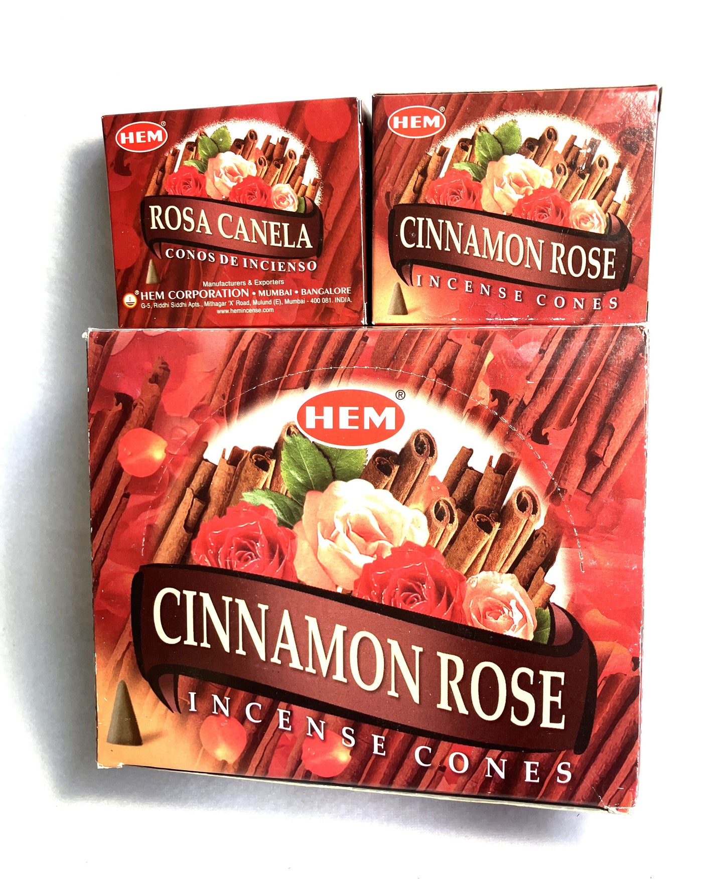 Master carton and two boxes of HEM Cinnamon Rose incense cones shown on a white background