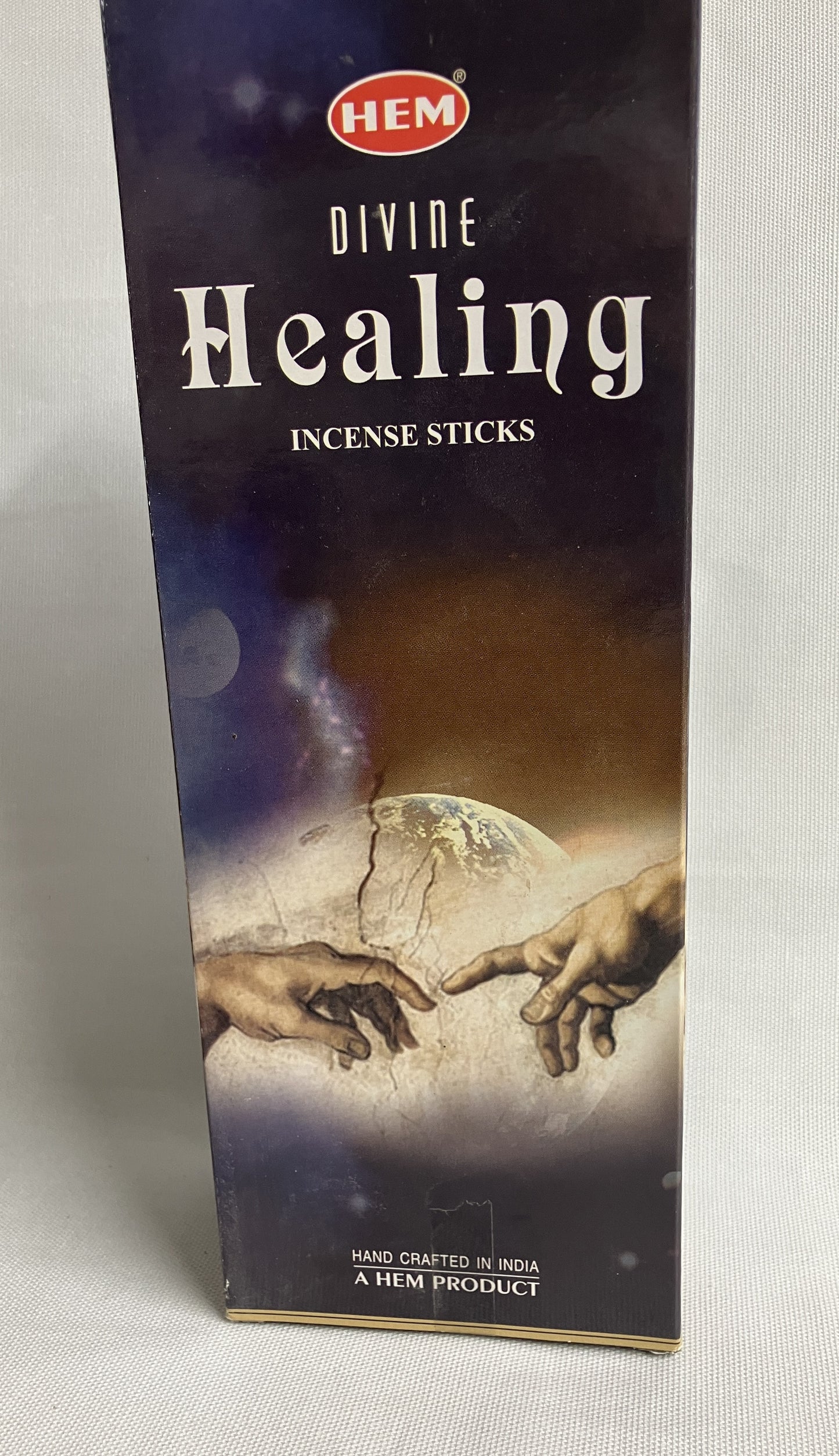 Box of HEM Divine Healing Incense Sticks with artistic design on a white background