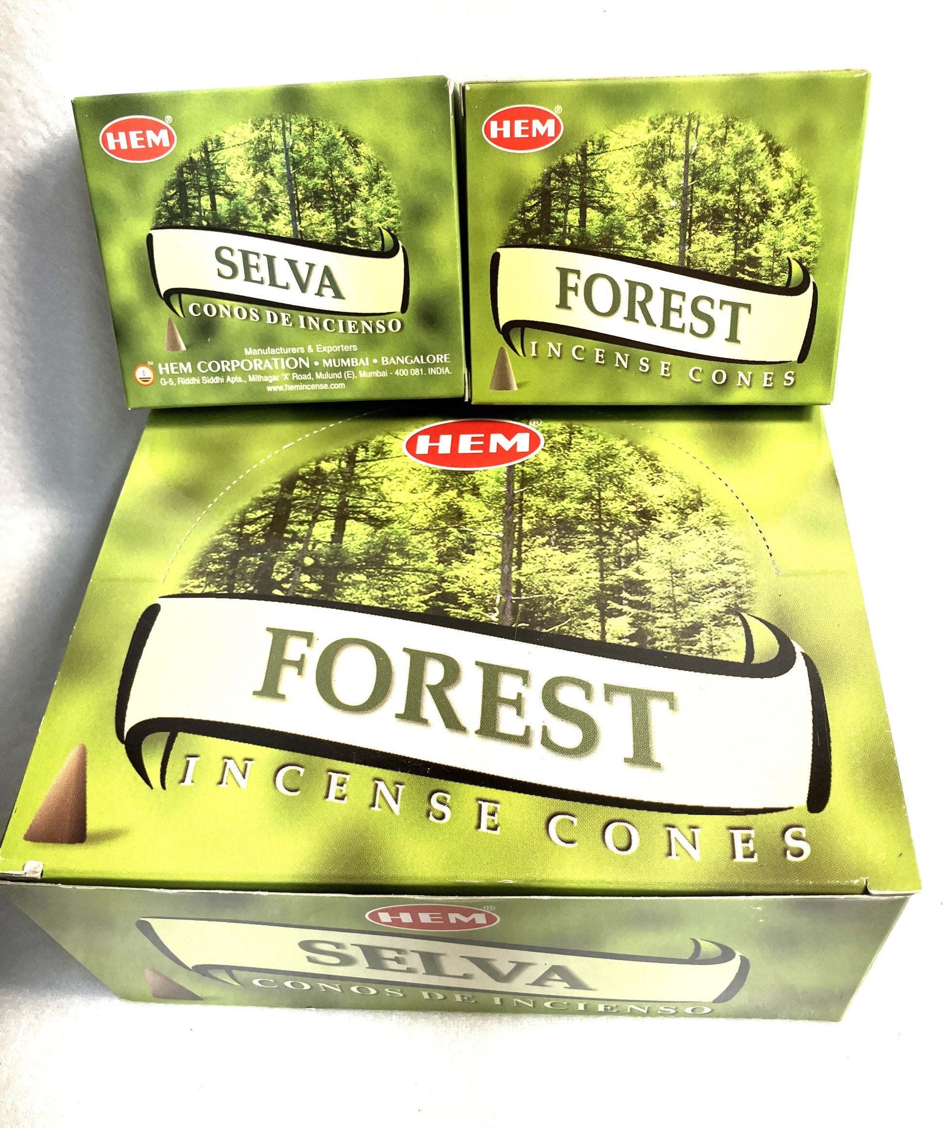 Master carton and two Boxes of HEM  Forest incense cones showing both English and Spanish titles on a white background