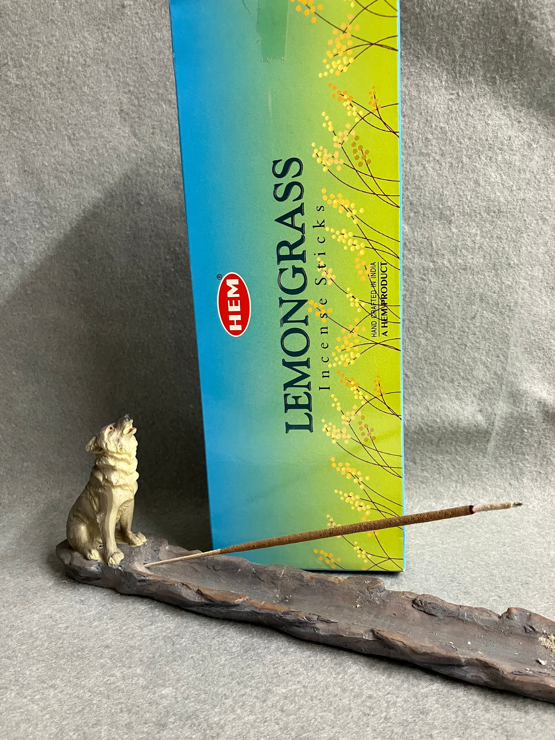 Lemongrass incense box shown behind a Wolf incense burner