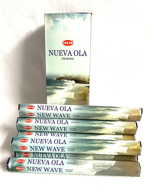 Stack of HEM Nueva Ola incense boxes on a white background