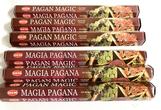 Multiple packages of HEM Pagana Magic and Magia Pagana incense sticks on a white background