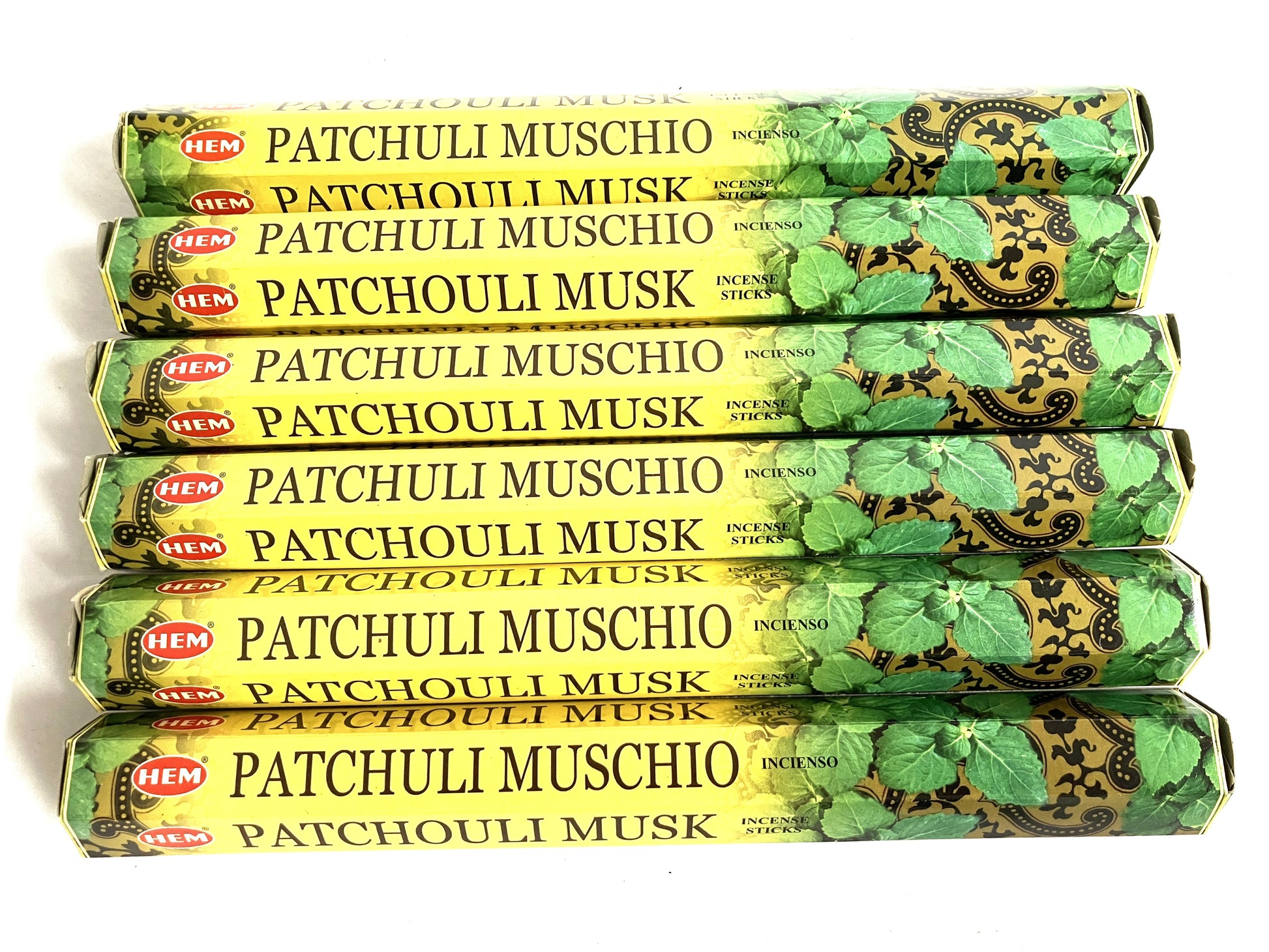 Multiple packages of HEM Patchouli Muschio incense sticks on a white background