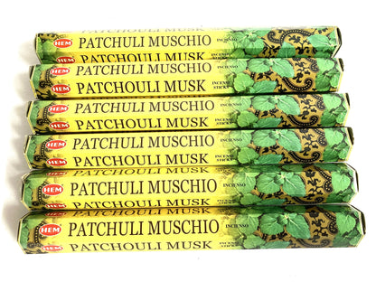 Multiple packages of HEM Patchouli Muschio incense sticks on a white background