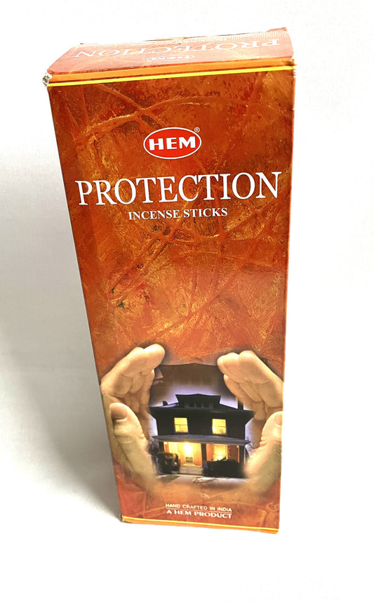 Box of HEM Protection Incense Sticks with a design of hands holding a house.