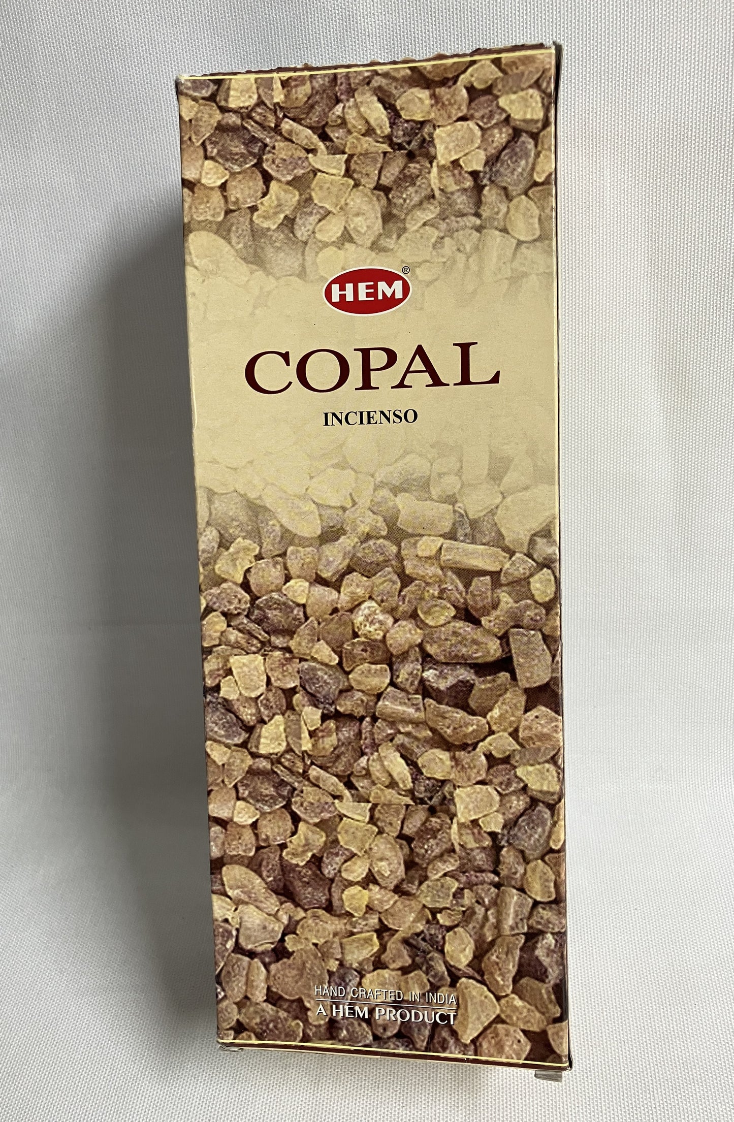 Box of HEM Copal incense on a light gray background